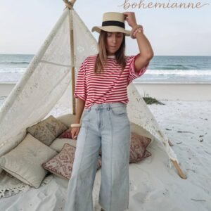 Jean court évasé femme bleu clair avec effet coupé en bas porté sur la plage style bohème californien